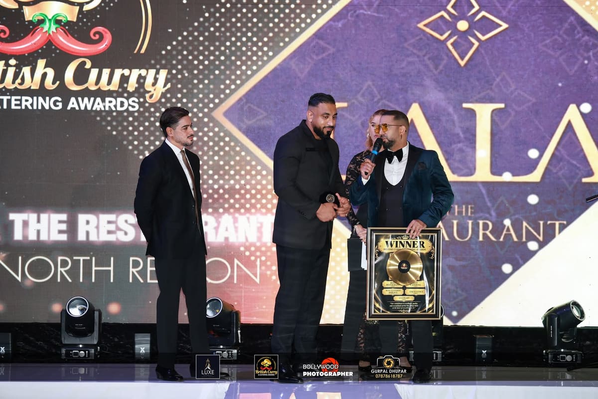 Representatives of Syhiba Restaurant receive the Restaurant of the Year award in Wakefield