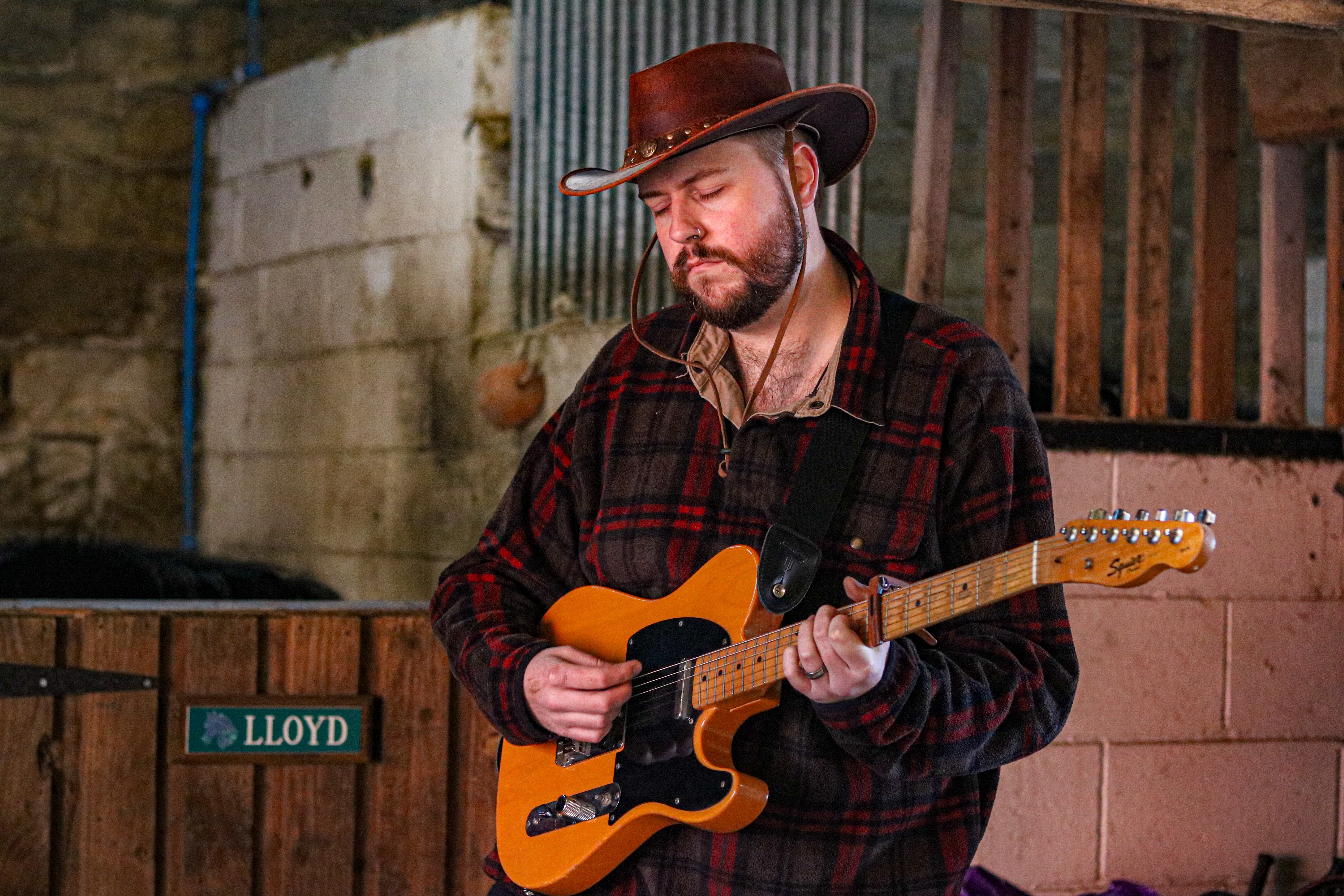 Jack Silver playing guitar outdoors